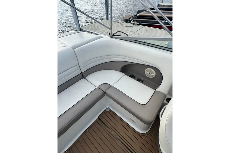 Slide: The Image of Interior seating of a 2000 Cobalt 226 boat with beige and white upholstery. - 15