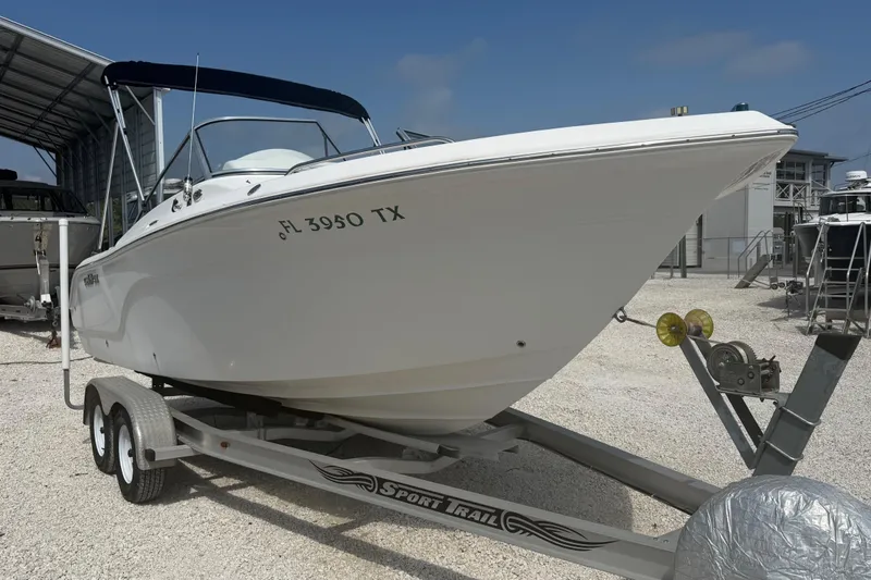 The Image of 2012 Sea Fox 216 Dual Console boat on trailer, parked outdoors. - 0