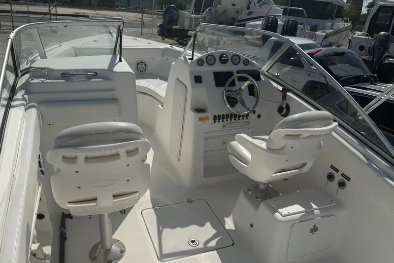 Slide: The Image of 2012 Sea Fox 216 Dual Console boat interior with steering wheel and seating. - 10