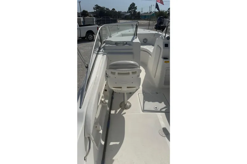 Slide: The Image of 2012 Sea Fox 216 Dual Console boat interior with seating and console view. - 13