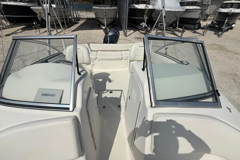 Slide: The Image of 2012 Sea Fox 216 Dual Console boat interior with open windshield and seating. - 16