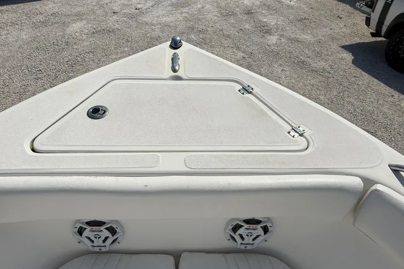 Slide: The Image of Bow area of a 2012 Sea Fox 216 Dual Console boat with storage compartment. - 17