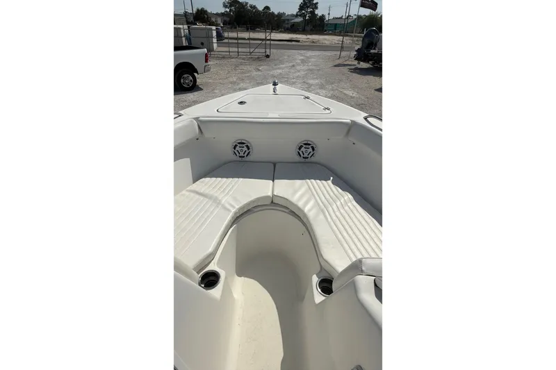 Slide: The Image of 2012 Sea Fox 216 Dual Console boat interior with white seating and cup holders. - 18