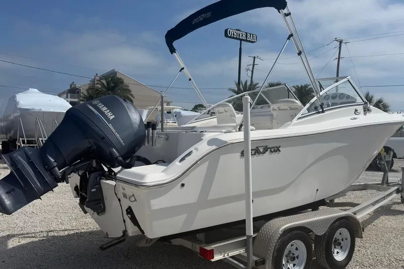 Slide: The Image of 2012 Sea Fox 216 Dual Console boat on trailer with Yamaha outboard motor. - 2