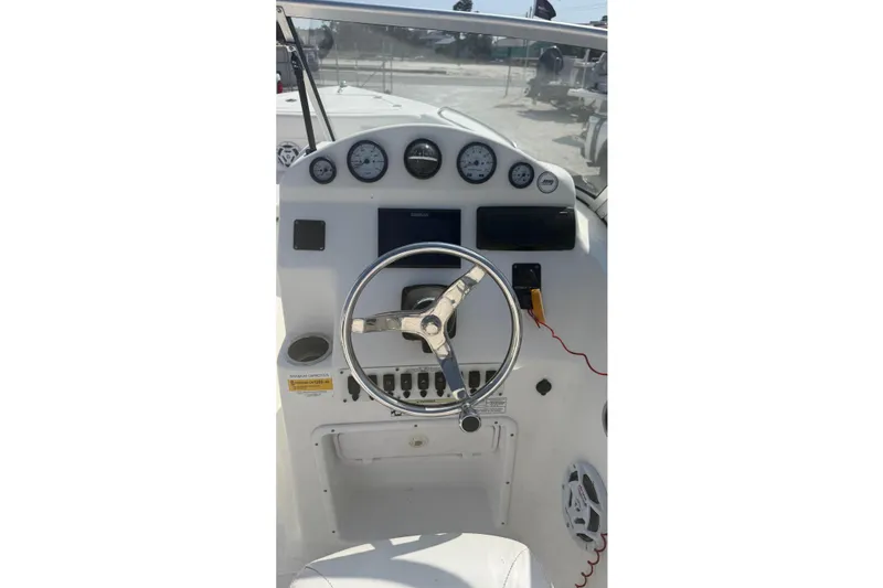Slide: The Image of Steering console of a 2012 Sea Fox 216 Dual Console boat with gauges and controls. - 22