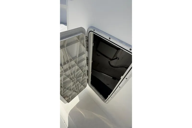 Slide: The Image of Open storage compartment on a 2012 Sea Fox 216 Dual Console boat. - 29