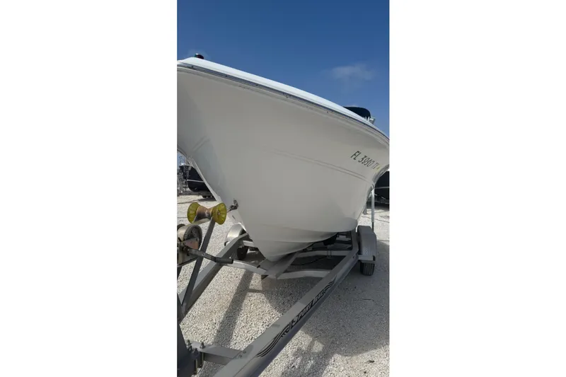 Slide: The Image of 2012 Sea Fox 216 Dual Console boat on trailer under clear blue sky. - 8