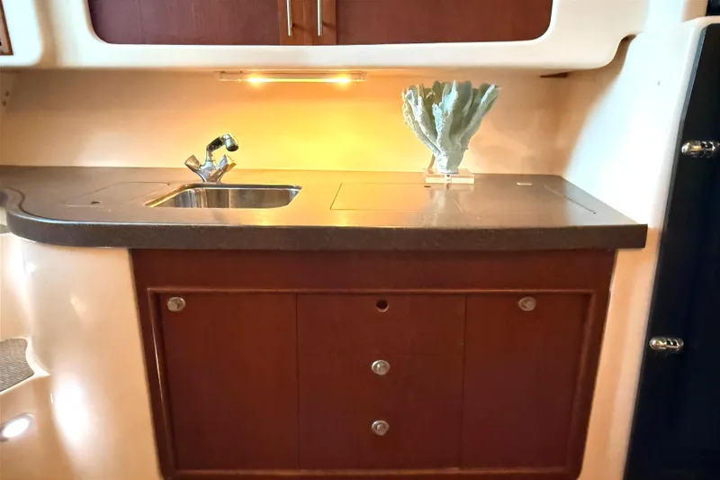 Slide: The Image of 2008 Grady-White Express 360 boat interior with sink and decorative coral. - 12