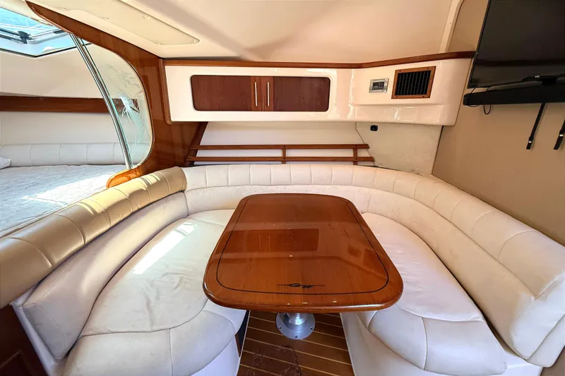 Slide: The Image of Luxurious interior of 2008 Grady-White Express 360 yacht with elegant seating and wooden table. - 14