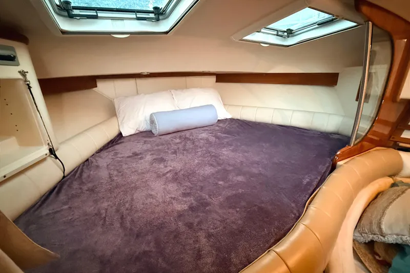 Slide: The Image of 2008 Grady-White Express 360 cabin interior with cozy bed and skylights. - 15