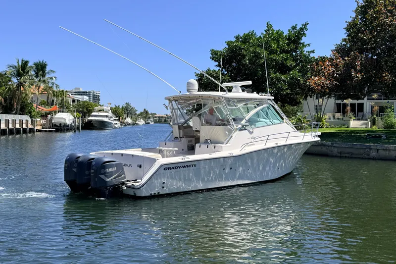 Slide: The Image of 2008 Grady-White Express 360 boat cruising on a scenic waterway. - 2