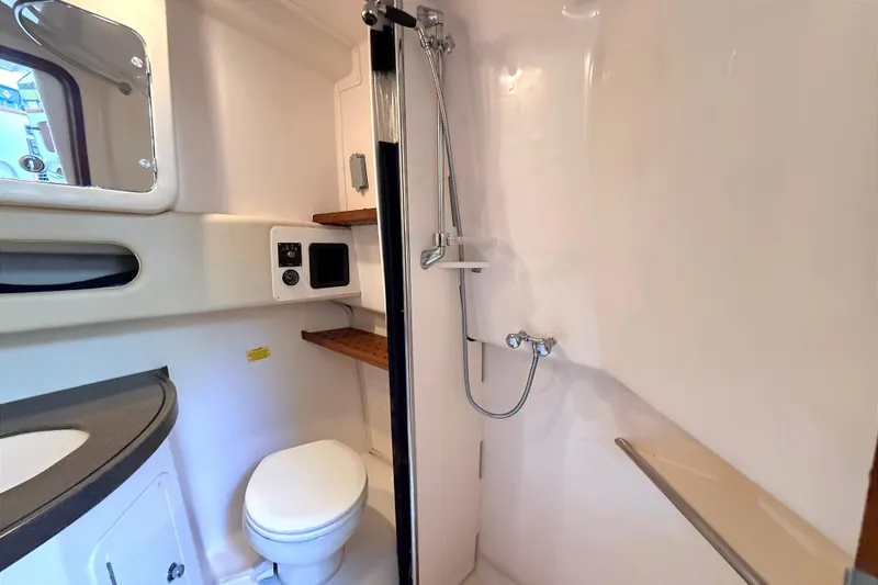 Slide: The Image of 2008 Grady-White Express 360 boat bathroom with shower, toilet, and sink. - 20