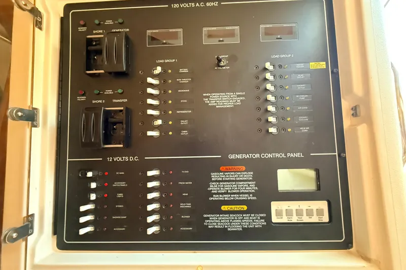 Slide: The Image of Electrical control panel on a 2008 Grady-White Express 360 boat. - 24