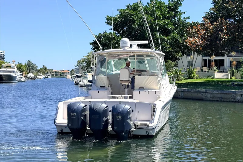 Slide: The Image of 2008 Grady-White Express 360 boat cruising on a scenic waterway. - 3