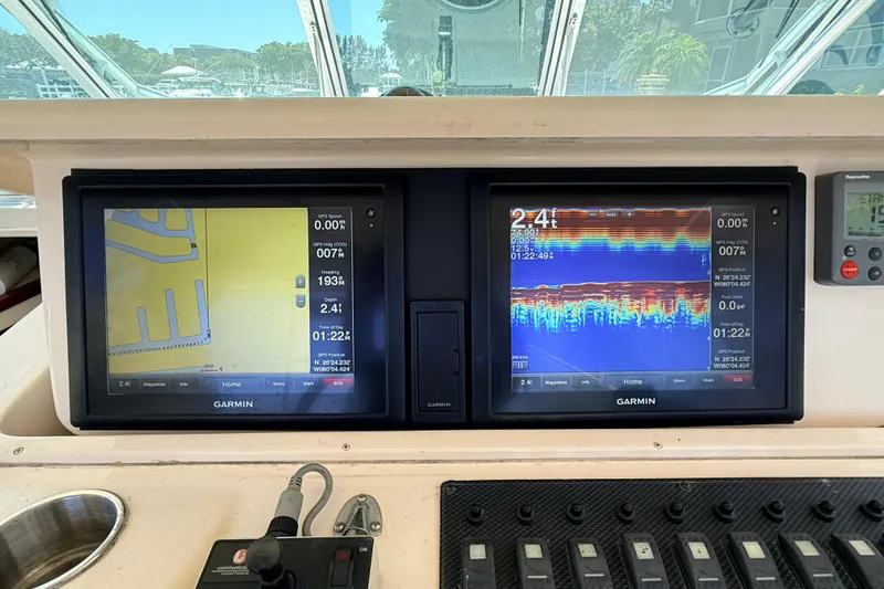 Slide: The Image of Dashboard of a 2008 Grady-White Express 360 with Garmin navigation displays. - 7
