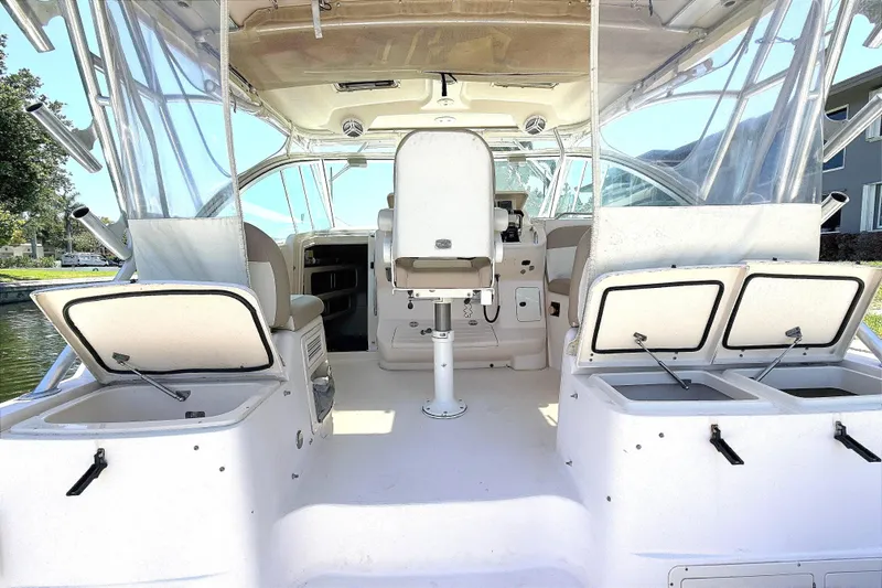 Slide: The Image of 2008 Grady-White Express 360 boat interior with open storage compartments and seating. - 8
