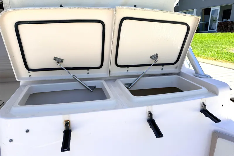 Slide: The Image of Open storage compartments on a 2008 Grady-White Express 360 boat. - 9