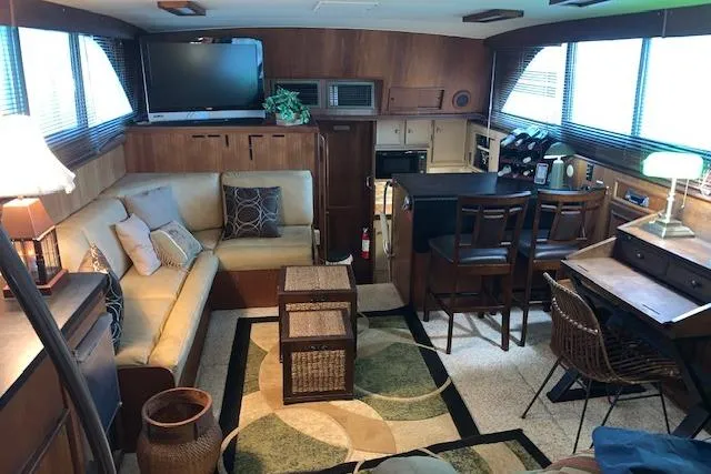 Slide: The Image of Interior of 1976 Hatteras 43 Double Cabin with cozy seating and modern amenities. - 21