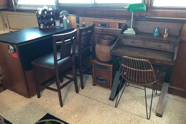 Slide: The Image of Interior of 1976 Hatteras 43 Double Cabin with desk and chairs. - 22