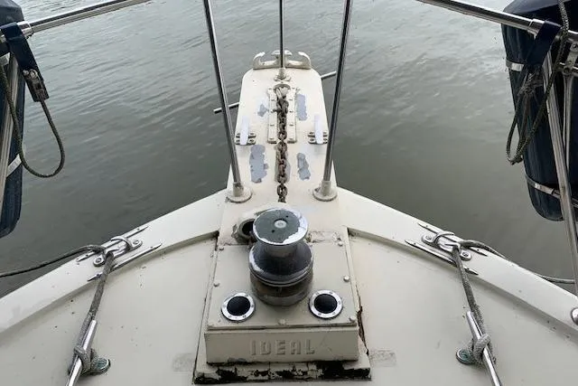 Slide: The Image of Bow of 1976 Hatteras 43 Double Cabin yacht with anchor chain and winch. - 3