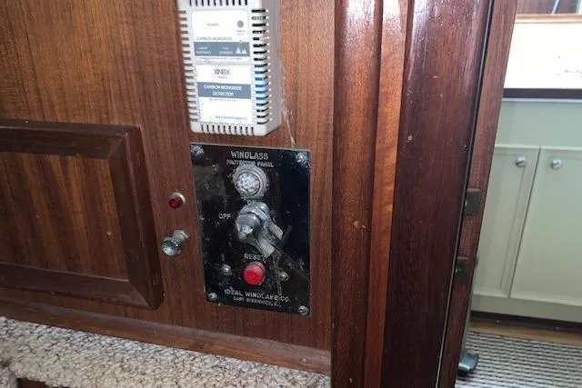 Slide: The Image of Control panel on 1976 Hatteras 43 Double Cabin yacht, featuring windlass and carbon monoxide detector. - 34