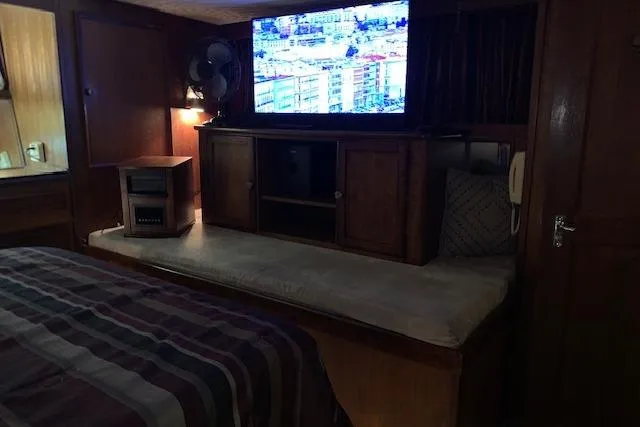 Slide: The Image of Interior of 1976 Hatteras 43 Double Cabin with TV and cozy seating area. - 39