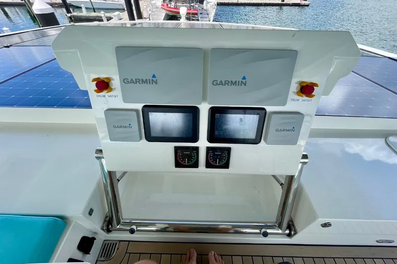 Slide: The Image of Cockpit of 2018 Serenity 64 yacht with Garmin navigation displays. - 21