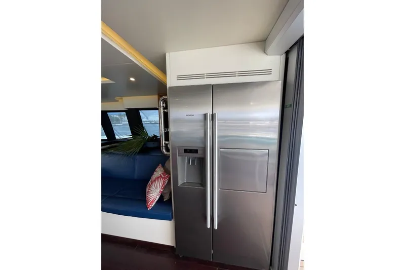 Slide: The Image of Stainless steel refrigerator on Serenity 64 yacht, 2018 model, with modern interior design. - 32