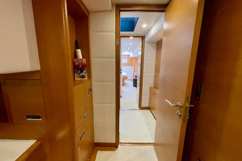 Slide: The Image of Interior view of 2018 Serenity 64 yacht, featuring wooden cabinetry and modern design. - 46