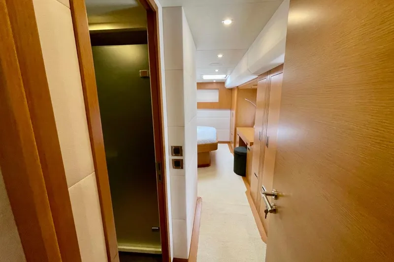 Slide: The Image of Luxurious interior of 2018 Serenity 64 yacht, featuring modern wood finishes and cozy bedroom. - 47