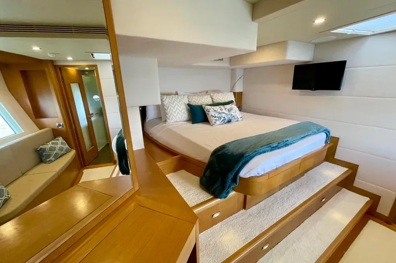 Slide: The Image of Luxurious Serenity 64 yacht bedroom interior, featuring a cozy bed and elegant decor, 2018 model. - 56