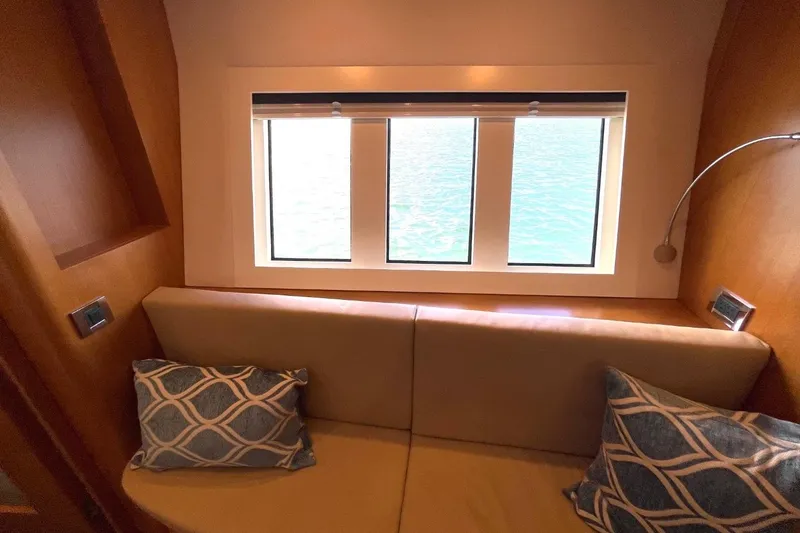 Slide: The Image of Luxurious interior of 2018 Serenity 64 yacht with cozy seating and ocean view. - 58
