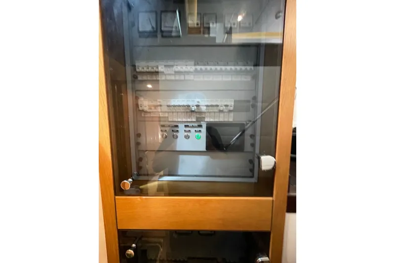 Slide: The Image of Electrical panel in a wooden cabinet, Serenity 64 model, 2018. - 63