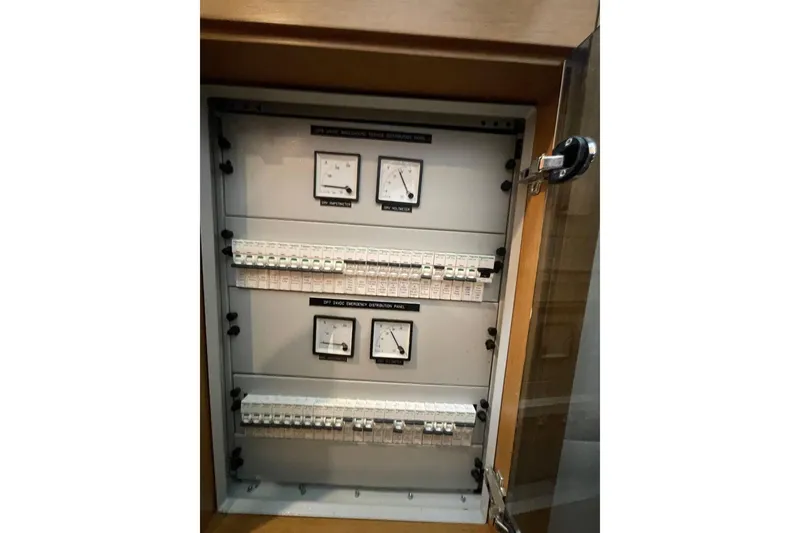 Slide: The Image of Electrical panel with gauges and switches in a Serenity 64, 2018 model. - 65