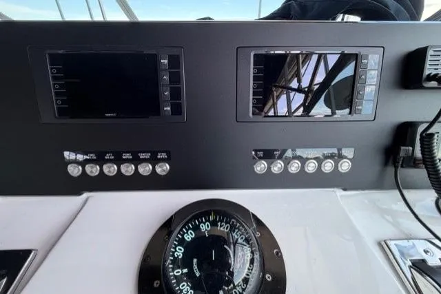 Slide: The Image of Dashboard of a 1989 Sea Ray 460 Express Cruiser with navigation instruments. - 13
