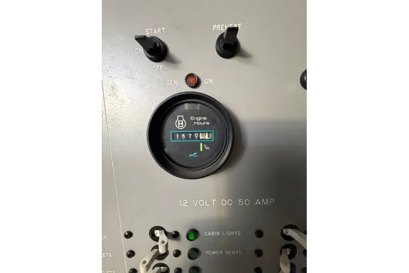 Slide: The Image of Control panel of a 1989 Sea Ray 460 Express Cruiser showing engine hours. - 21