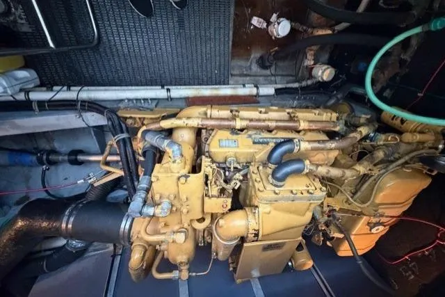 Slide: The Image of Engine room of a 1989 Sea Ray 460 Express Cruiser, showcasing detailed mechanical components. - 28
