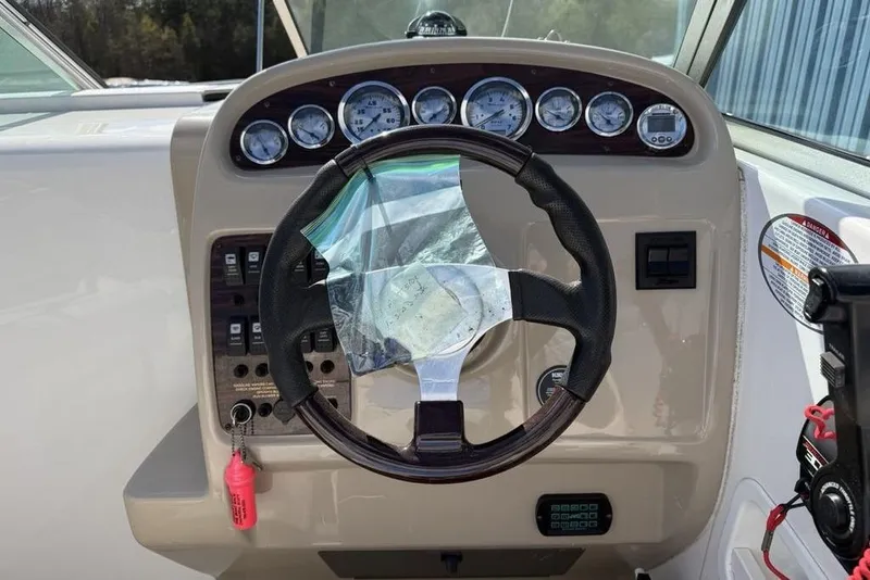 Slide: The Image of Steering wheel and dashboard of 2000 Chaparral Signature 240 boat. - 14