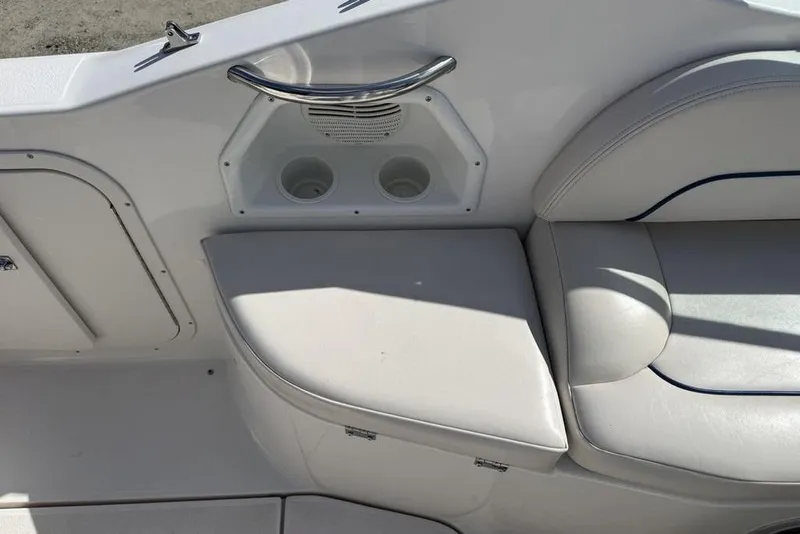 Slide: The Image of Interior seating and cup holders on a 2000 Chaparral Signature 240 boat. - 15