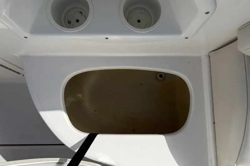 Slide: The Image of Storage compartment in a 2000 Chaparral Signature 240 boat interior. - 16