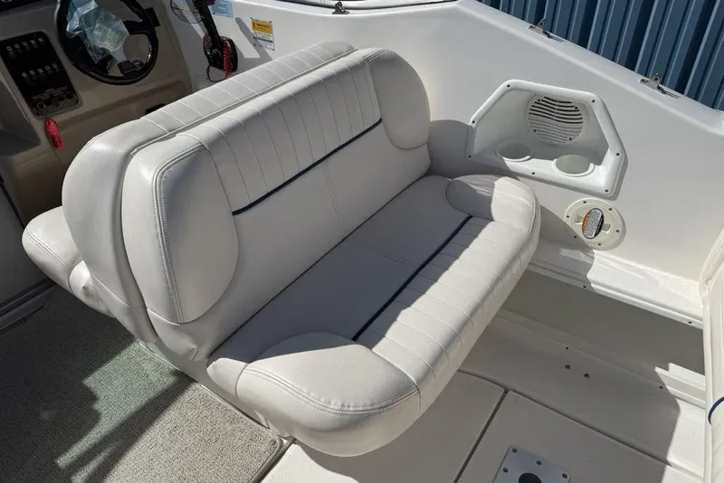 Slide: The Image of 2000 Chaparral Signature 240 boat interior with white seating and cup holders. - 19