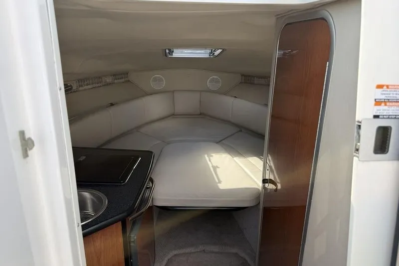 Slide: The Image of Interior cabin of 2000 Chaparral Signature 240 boat with seating and kitchenette. - 20