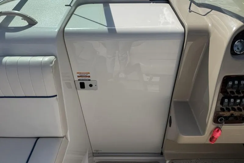 Slide: The Image of 2000 Chaparral Signature 240 boat interior with seating and control panel. - 23