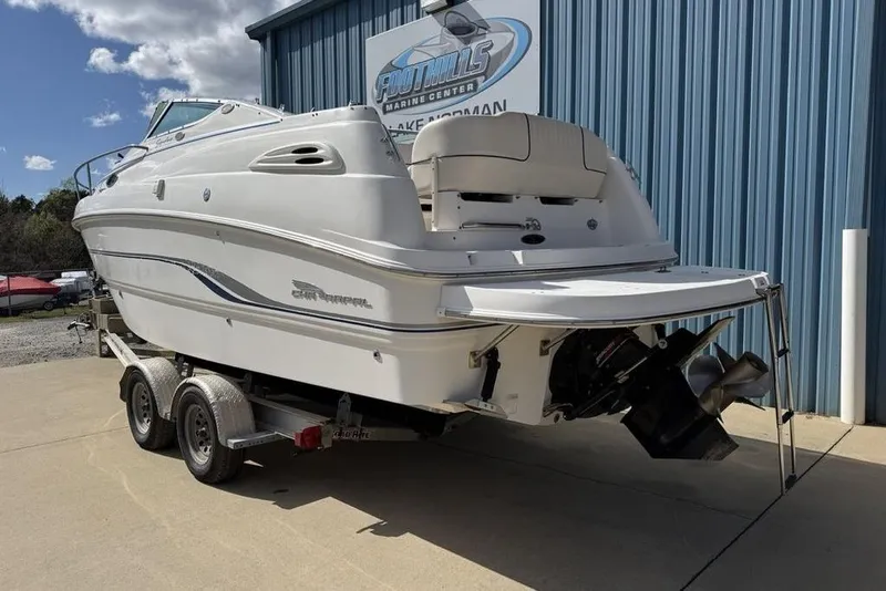 Slide: The Image of 2000 Chaparral Signature 240 boat on trailer at marine center. - 4