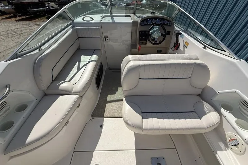 Slide: The Image of 2000 Chaparral Signature 240 boat interior with white seating and steering console. - 46