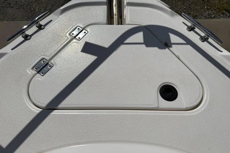 Slide: The Image of Deck hatch of a 2000 Chaparral Signature 240 boat with metal hinges. - 6