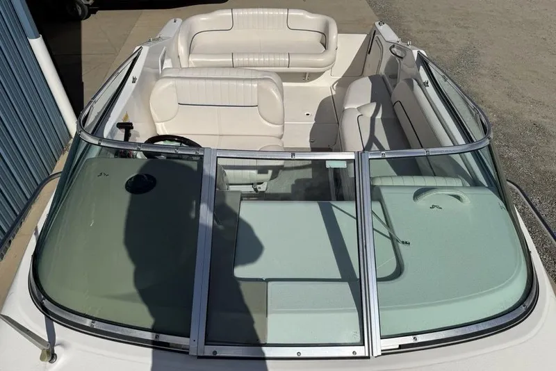 Slide: The Image of 2000 Chaparral Signature 240 boat interior with white seating and windshield. - 7