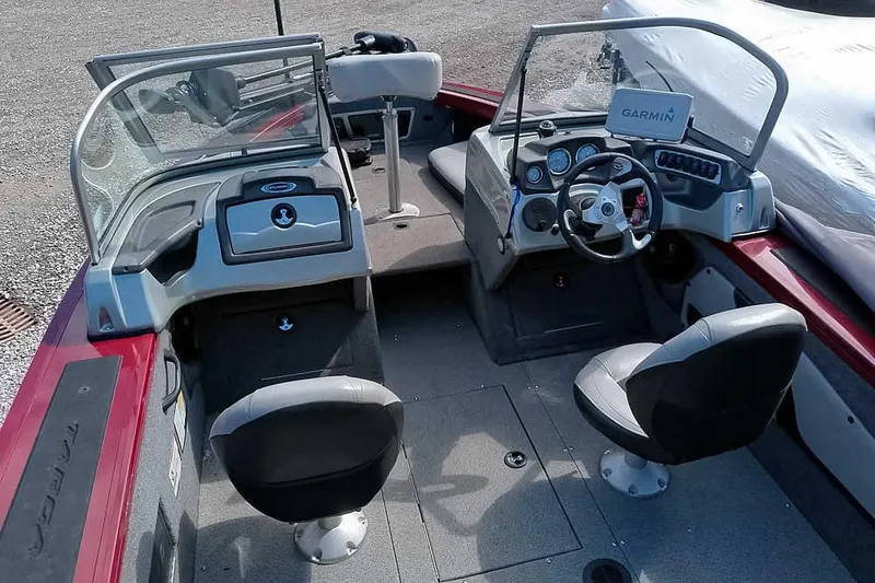 Slide: The Image of 2018 Tracker Targa V-18 Combo boat interior with steering wheel and seating. - 12