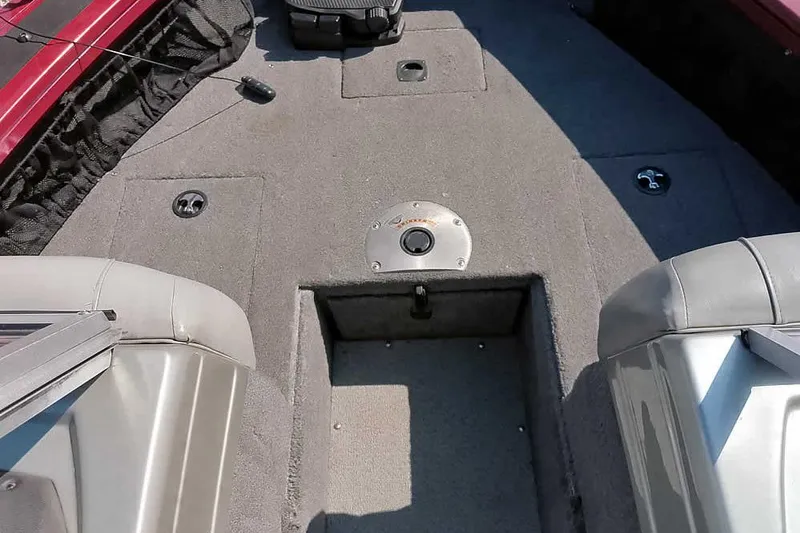 Slide: The Image of 2018 Tracker Targa V-18 Combo boat interior with carpeted deck and seating. - 16