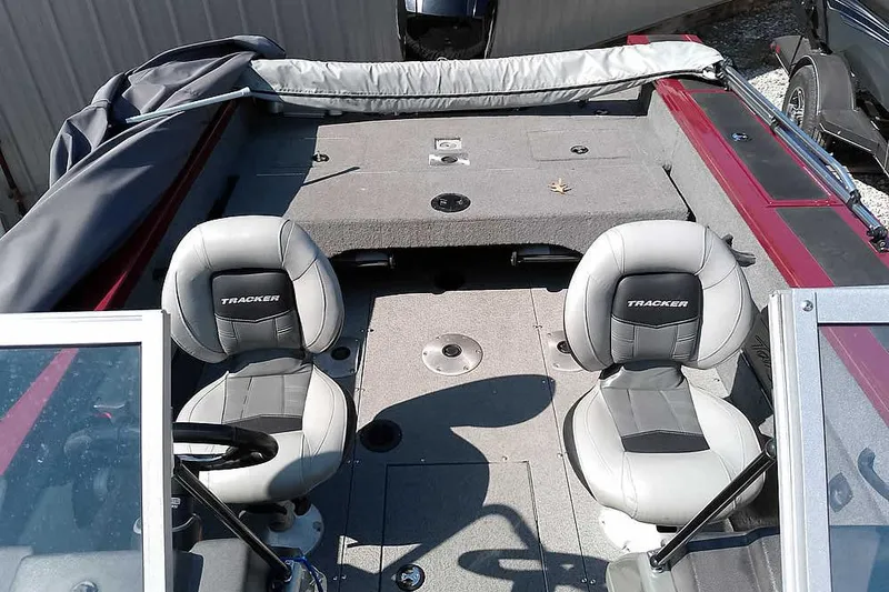 Slide: The Image of 2018 Tracker Targa V-18 Combo boat interior with two seats and steering wheel. - 24